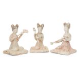 Three Chinese pottery kneeling female attendants, Tang dynasty, each with painted features and