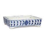 A Chinese porcelain rectangular jardinière, late 19th century, painted in underglaze blue with