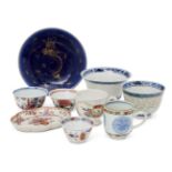 Nine pieces of Oriental porcelain, 18th-early 20th century, comprising a blue-glazed dish painted in