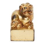 A Chinese gilt bronze square seal, early 20th century, cast as a seated Buddhist lion, 8cm