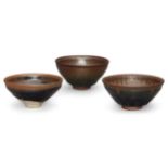 Three Chinese stoneware Jian hare's fur tea bowls, late Qing dynasty, 13cm - 12cm diameterSome minor