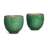 A pair of Chinese porcelain apple-green glazed cups, 18th century, the exterior covered with apple-