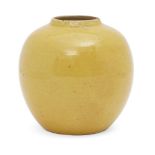A Chinese porcelain monochrome jar, Jiaqing mark and of the period, covered in an egg-yolk yellow