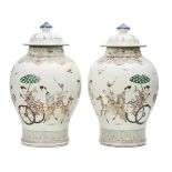 A pair of large Chinese porcelain baluster jars and covers, late Qing dynasty, painted in famille
