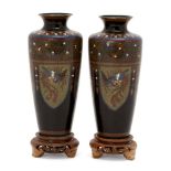 A pair of Japanese cloisonné vases, Meiji period, decorated with alternating panels of dragons and