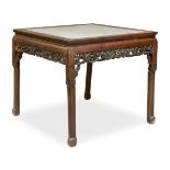 A Chinese hardwood and marble inset square table, late 19th century, the square top above carved