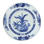 A Chinese export porcelain dish, 18th century, painted in underglaze blue with a deer amongst bamboo
