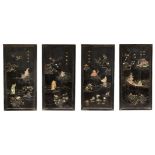 A set of four Chinese hardwood framed black lacquer and hardstone inset panels, late Qing dynasty,
