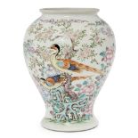 A Chinese porcelain baluster vase, early 20th century, painted in famille rose enamels with exotic