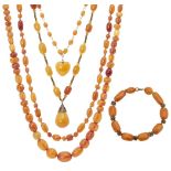 A collection of amber jewellery, early 20th century, comprising four bead necklaces and a