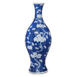 A large Chinese porcelain vase, 19th century, painted in underglaze blue with prunus blossom, 45cm