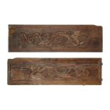 A pair of Chinese wood rectangular panels, 19th century, each decorated in relief with chi-long