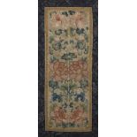 A Chinese silk embroidered panel, late 19th century, decorated with flowering peonies inside a lotus