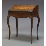 A French mahogany and inlaid bureau de dame, second half 19th Century, the top with three quarter