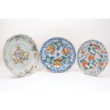 A late18th/early19th century Delft ware plate, the circular bowl decorated in birds and leaf form