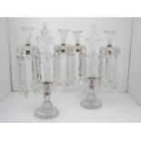 A pair of cut glass two light candelabra with cut glass droppers, 48cm high (2)Please refer to