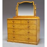A Victorian satinwood dressing chest by Heal & Son, the top surmount with later mirror, on turned