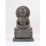 A Gandharan-style large grey schist figure of a meditating buddha, 20th century, modelled wearing