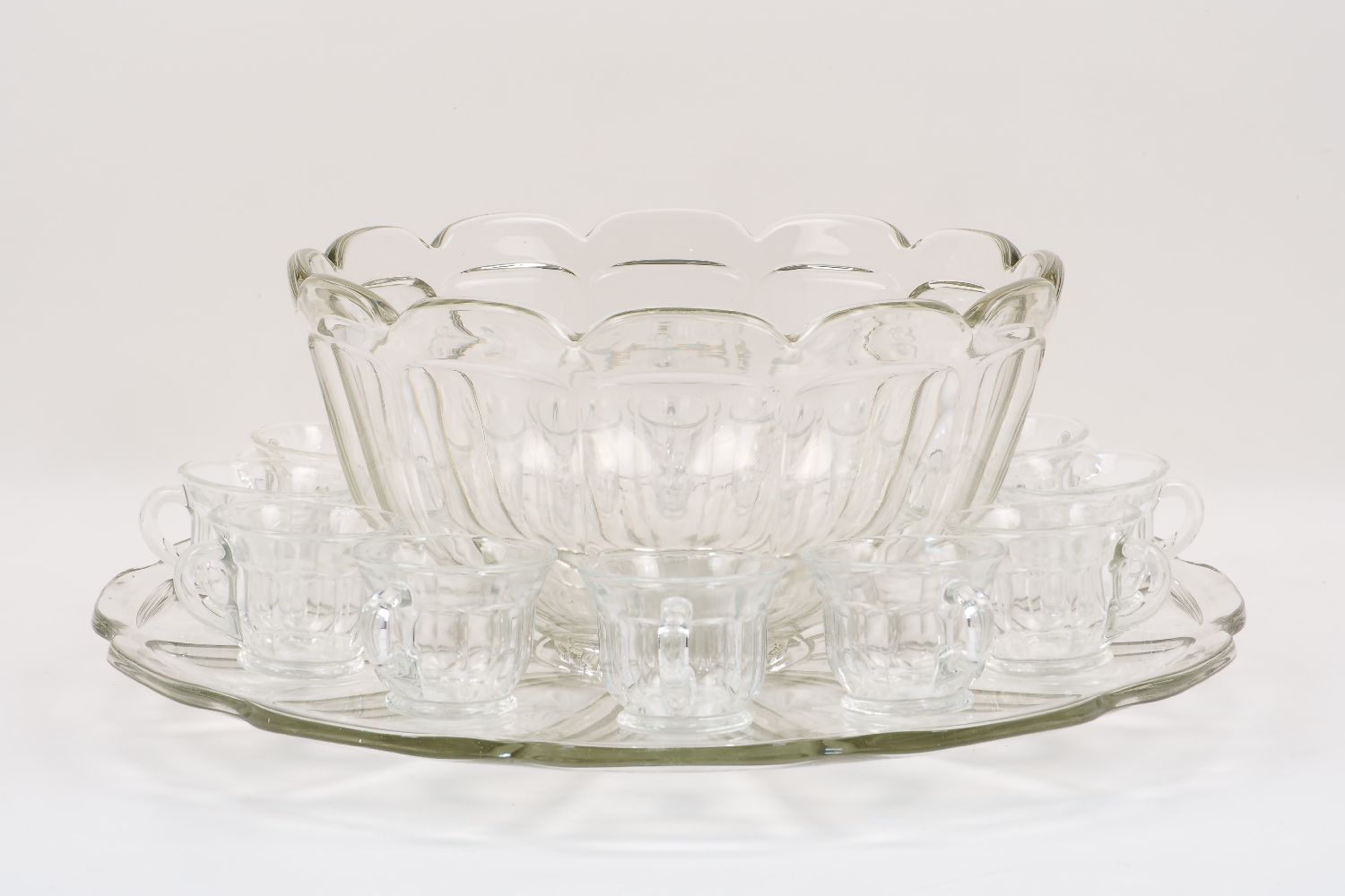 A 20th century Art Deco style glass punch bowl and stand, both of large proportions, of a twelve