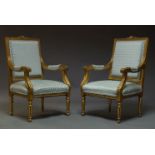 A pair of Louis XVI style giltwood fauteuils, second half 20th Century, the crest rail centred by