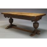 A 17th Century style oak drawer leaf table, early 20th Century, the rectangular five plank top