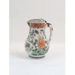 An early 20th century continental chocolate pot and cover, decorated in an all over Chinoiserie