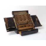 A Victorian coromandel stationary box, of typical form, the hinged sloped doors encasing letter