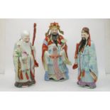 Three Chinese porcelain models of sages, late 20th century, printed and impressed marks to base,