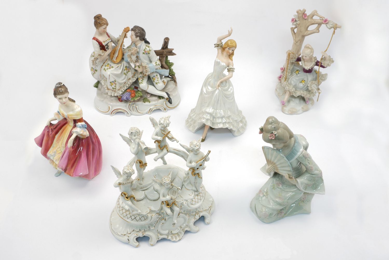 A Royal Doulton figure, "Southern Belle", H. N. 2229, together with a Lladro style Japanese lady and