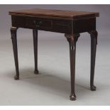 A George II oak tea table, the rectangular fold over top above single frieze drawer on cylindrical