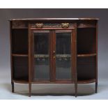 A Victorian side cabinet, the shaped top above foliate carved frieze with single drawer, over two