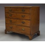 A George III mahogany chest of drawers, with brush slide, above four long graduated drawers,