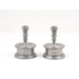 A pair of Spanish pewter capstan candlesticks, by Pedraza Segovia, with short, knopped stems to