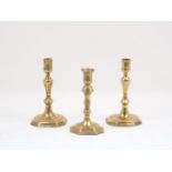 An English brass candlestick, circa. 1720, of typical form, with knopped inverted baluster stem,