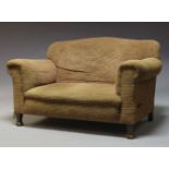 An Edwardian drop end sofa, with serpentine shaped back, upholstered in beige fabric, with one