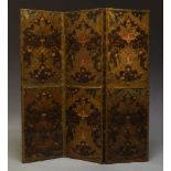 A French embossed leather three fold screen, decorated with birds and foliate sprays, with gilt