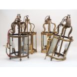 A pair of brass curving hexagonal form hall lanterns, 20th century, with scrolling form tops to