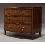 A Regency mahogany bow fronted chest of drawers, with brushing slide over three long graduated