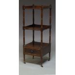 A mahogany three-tier square whatnot, mid-19th Century, with ring turned supports and single base