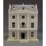 A Georgian Palladian style doll’s house by ‘The Doll’s House Emporium’, retailed by Harrods, to