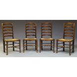 A set of four elm Lancashire ladderback chairs, early to mid 20th Century, with shaped