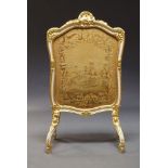 A Louis XV style white painted and parcel gilt fire screen, 20th Century, of cartouche shape, with