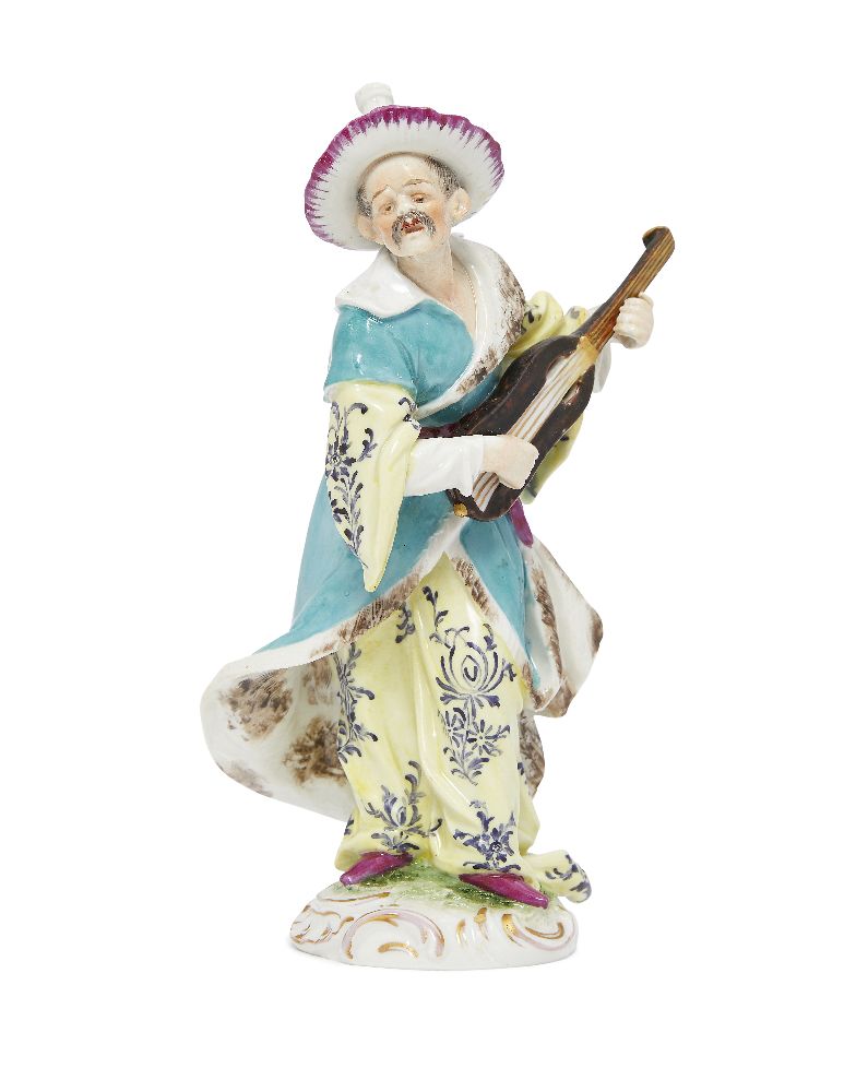 A German porcelain figure of a man playing a mandolin, in the Meissen style, late 19th century, he