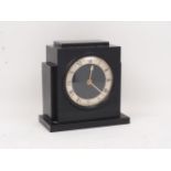 A 20th century Art Deco style mantle clock, the dial with Roman numerals, white metal batons,