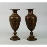 A pair of Persian lacquered metal vases, late 19th/early 20th century, with shaped panels to front