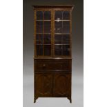 A mahogany secretaire bookcase, 19th Century, the moulded cornice, above two astragal glazed