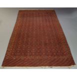 An Anatolian Kilim, with repeat geometric motif in red field, 318cm x 196cm, together with another