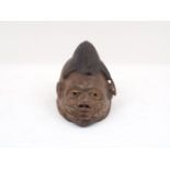 A Yoruba style dance mask, 20th century, with headdress detail, 30cm long (AF)Please refer to