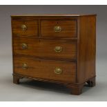A Regency mahogany bow front chest, with two short over two long graduated drawers, raised on shaped
