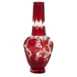 A Chinese Peking red-overlay glass bottle vase, early 20th century, carved with figures in a village